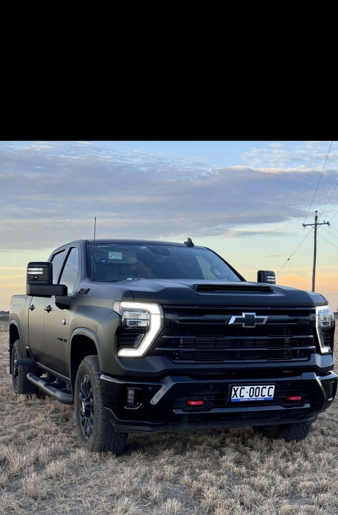 Wide field shot of matte black Silverado wrap