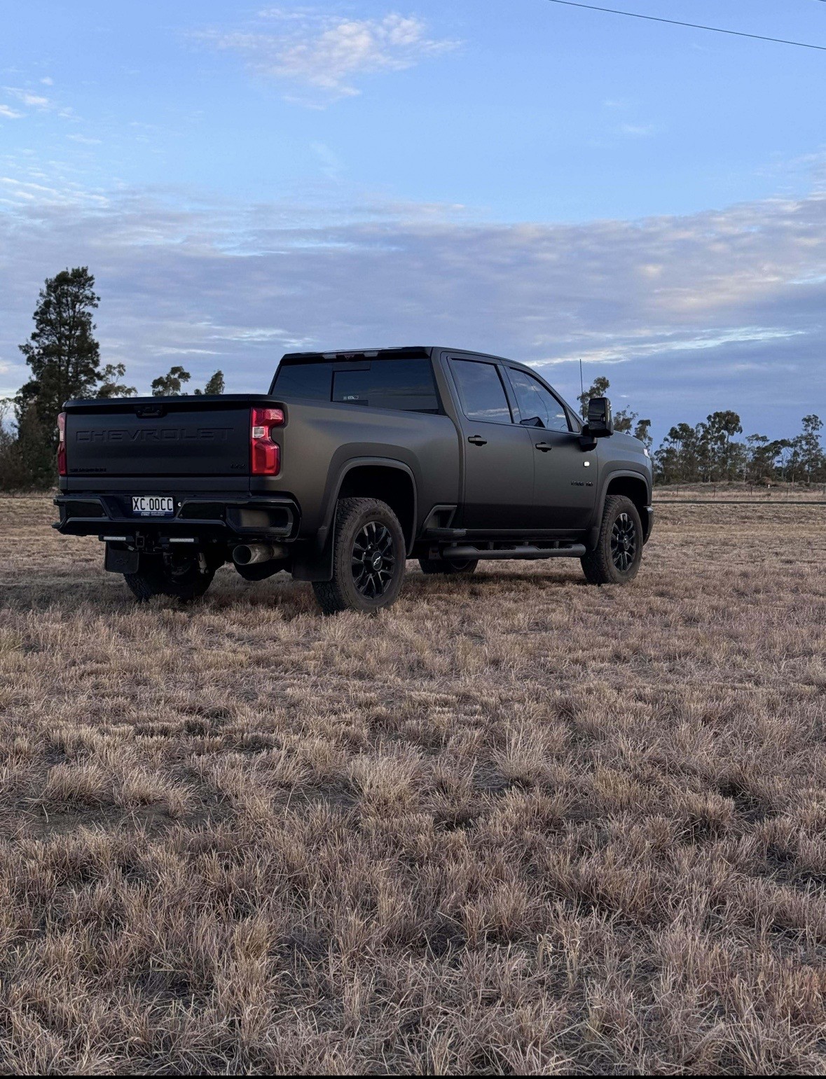 Rear three quarter matte black Silverado wrap
